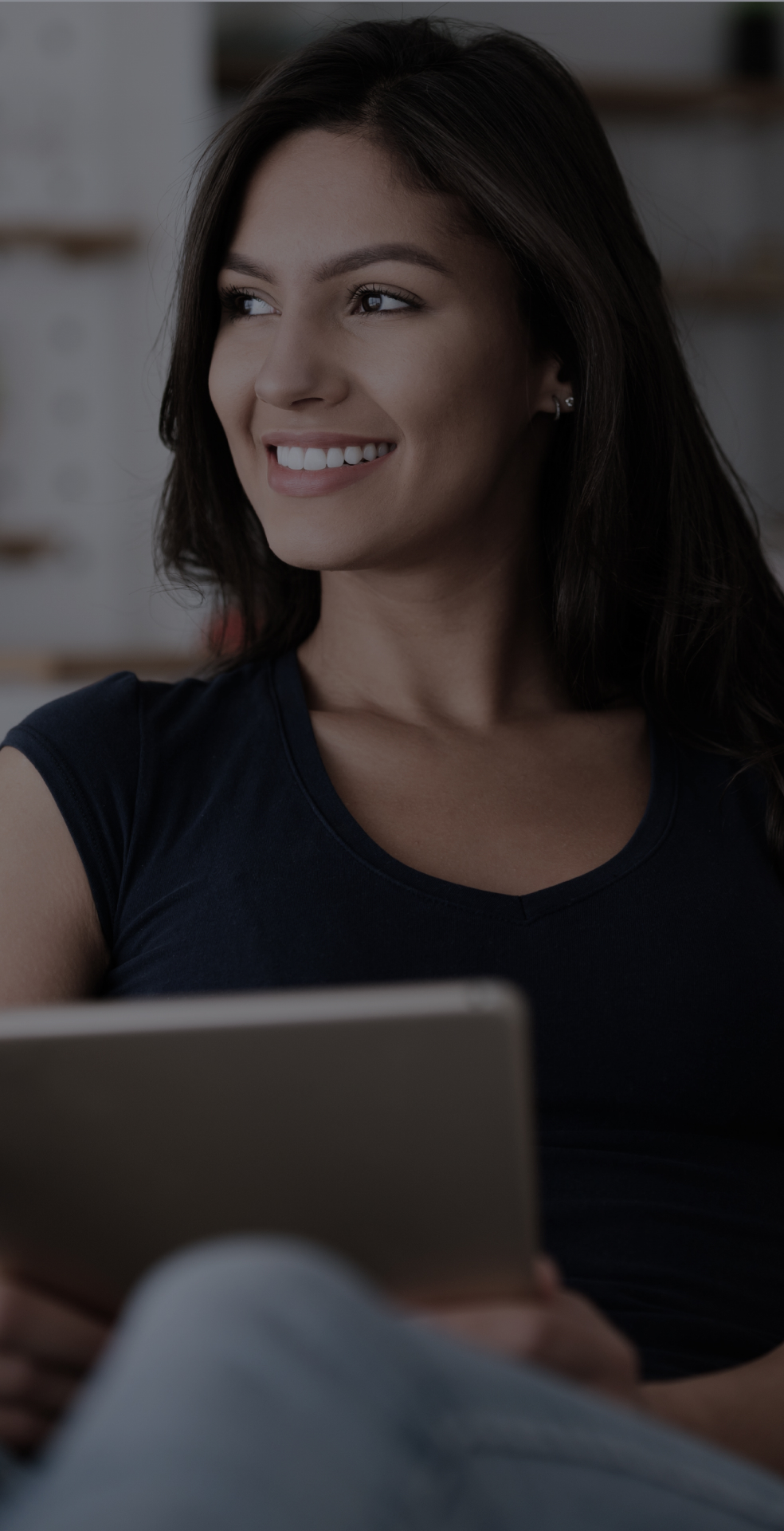 Smiling woman with digital device