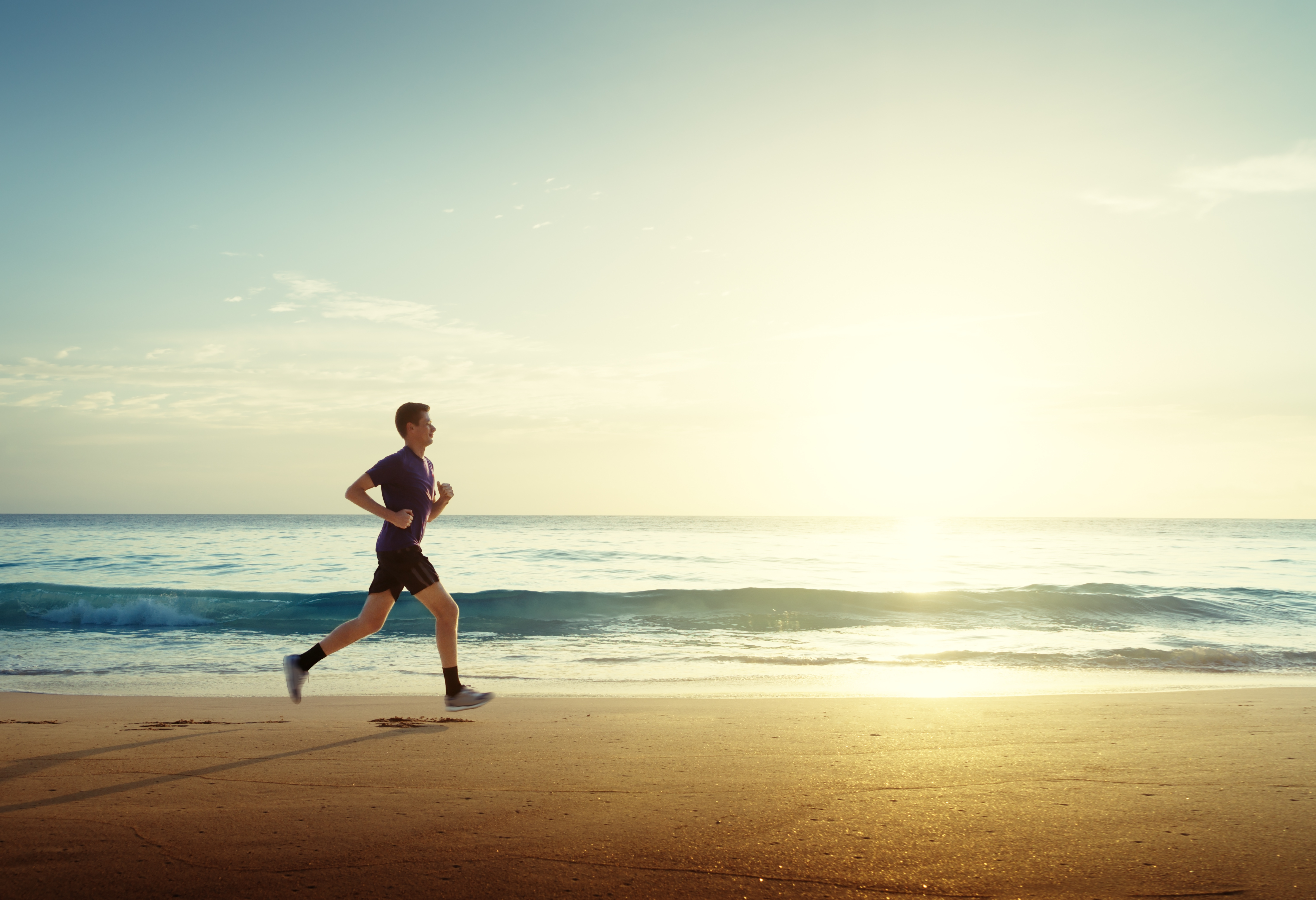man running near beach