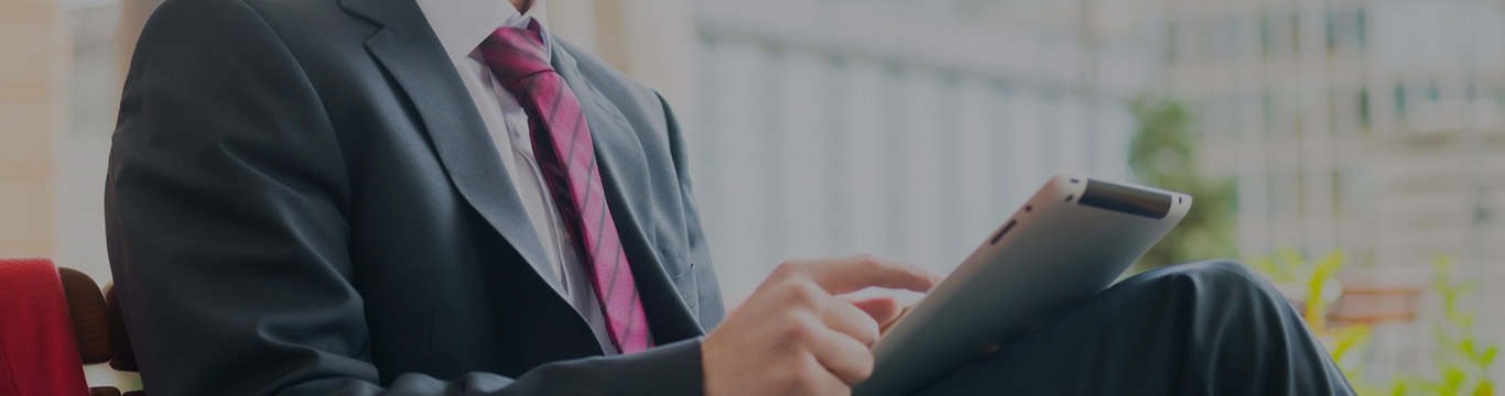 Businessman using pen to tick correct 